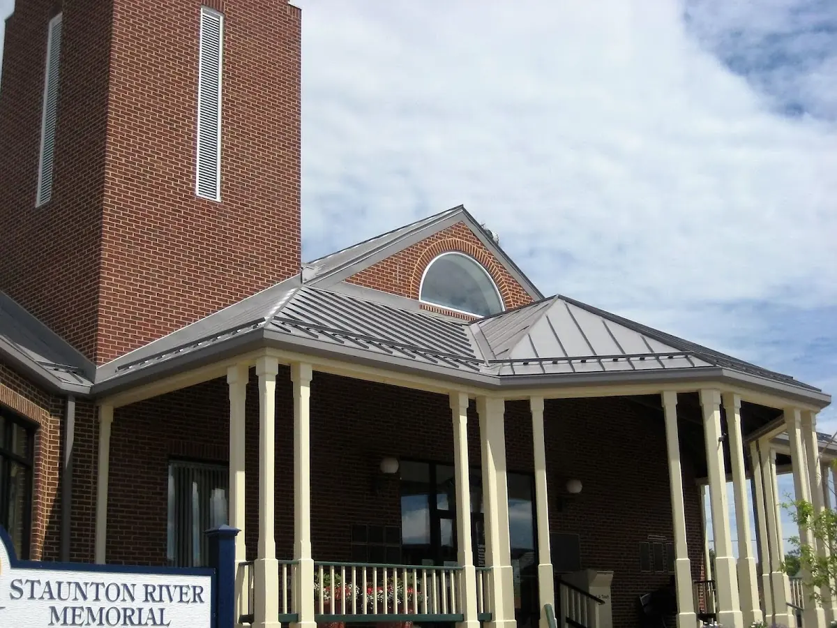 Skilled roofing craftsmen working on a residential roof in Des Moines